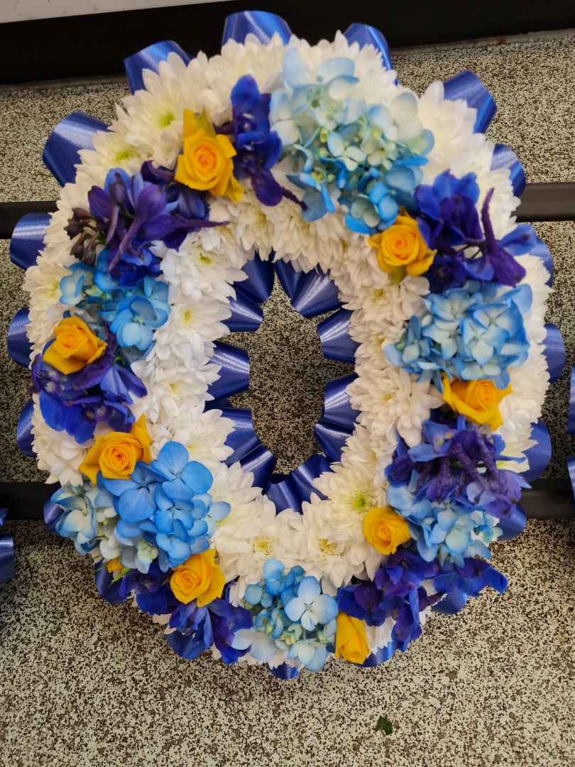 Based Letters with flowers in centre.