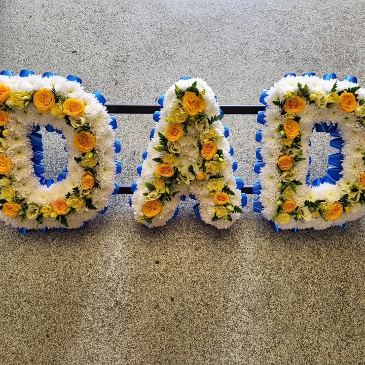 Based Letters with flowers in centre.
